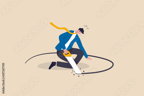 Business or financial mistake, wrong decision or stupidity make problem and situation worst concept, foolish frustrated businessman sawing the floor to self sabotage or make himself fall with failure. photo