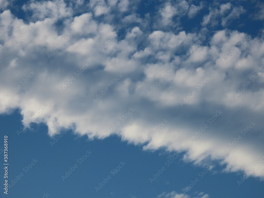 Beautiful background of blue sky and white clouds in autumn in Israel close-up.