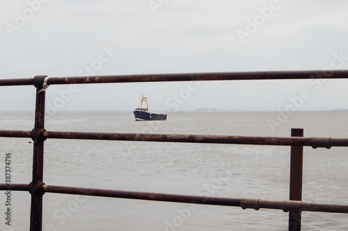 Cockle Boat off Leigh-on-Sea in Essex, in a bleak Thames Estuary  photo