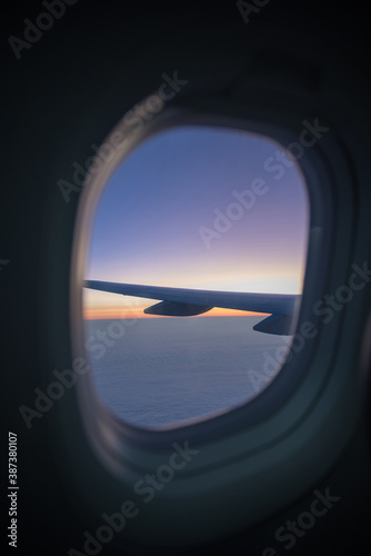 view out of an airplane window, beautiful sunset