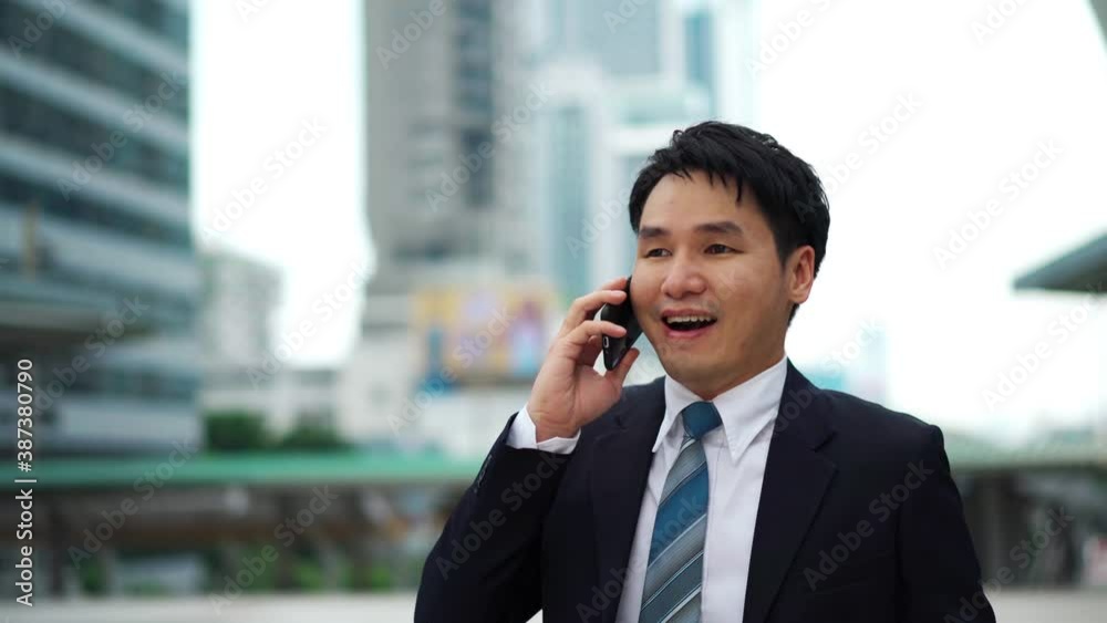 successful business man talking a mobile phone in the city successful business man talking a mobile phone in the city