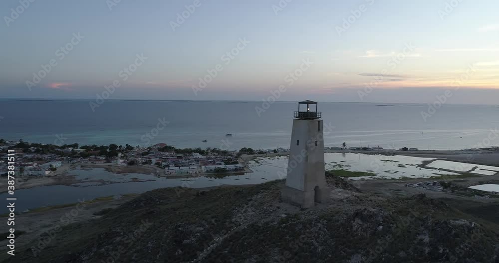 Aerial view of SUNSET the lighthouse of Gran Roque island, Caribbean sea, Los Roques, Venezuela. landscape Vacation travel. Travel destination. Vacation concept. Aerial view of SUNSET the lighthouse of Gran Roque island, Caribbean sea, Los Roques, Venezuela. landscape Vacation travel. Travel destination. Vacation concept.