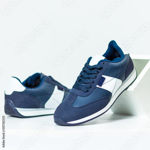 Blue male sneakers shoes isolated background