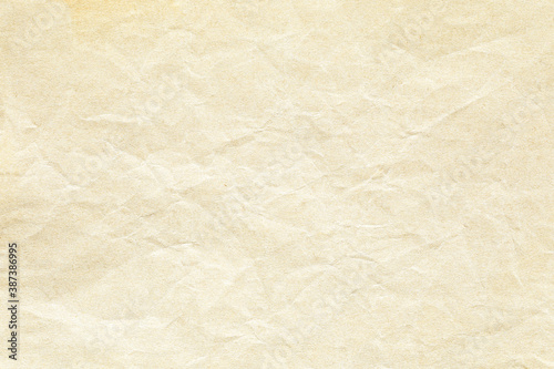 Yellow crumpled paper background texture 
