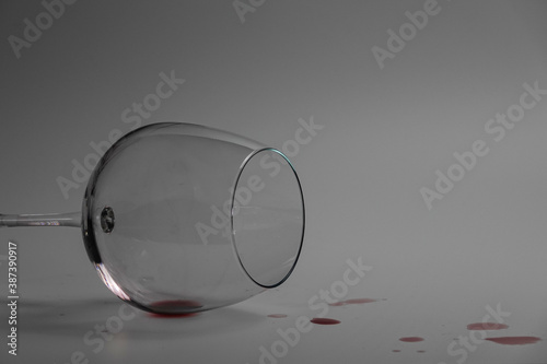 Overturned glass and spilled wine 