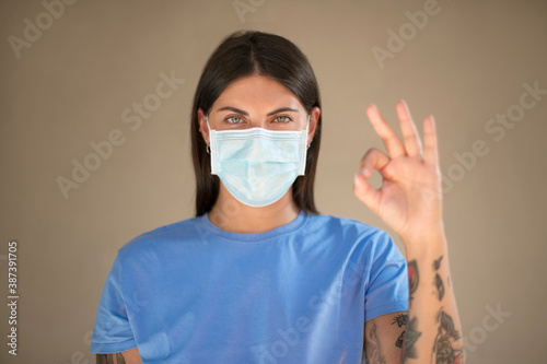 Young woman wearing medical face mask for corona virus.