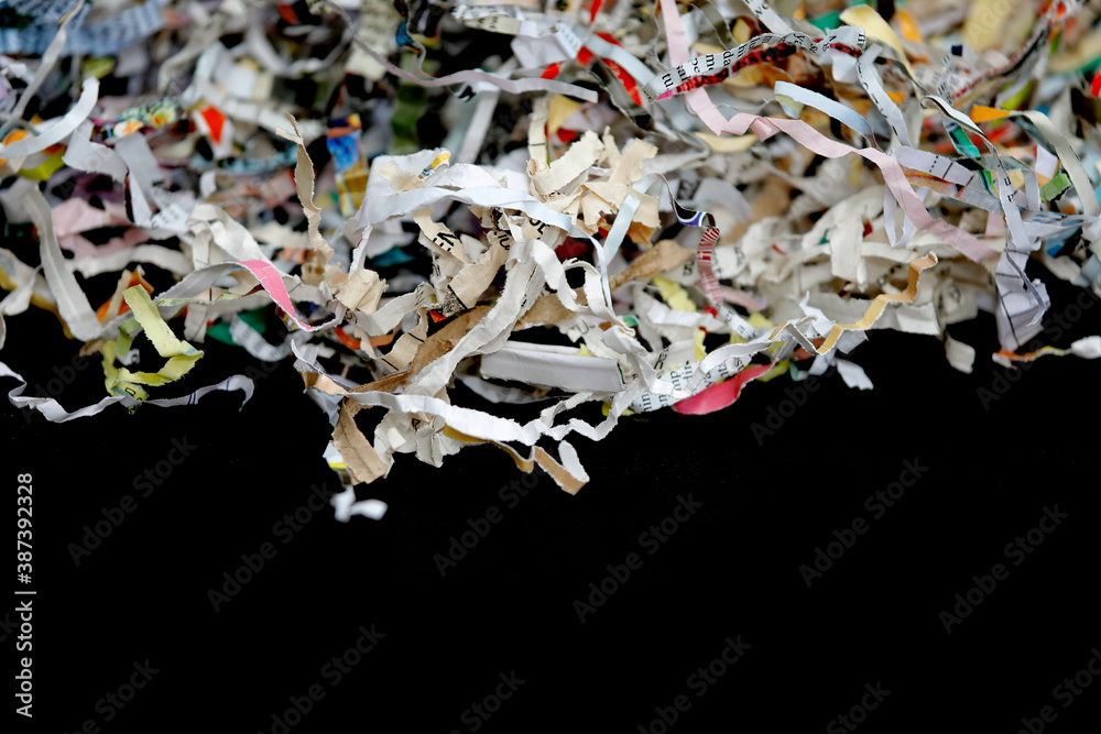 Scraps of paper, Shredded colorful paper, close-up, black background, with copy space. Scraps of paper, Shredded colorful paper, close-up, black background, with copy space.