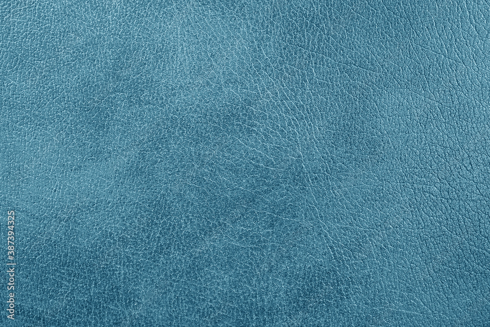 Blue natural leather, close-up, isolated background for design