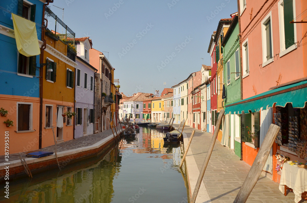Burano is an island in the Venetian Lagoon, northern Italy, near Torcello at the northern end of the lagoon, known for its lace work and brightly coloured homes.
