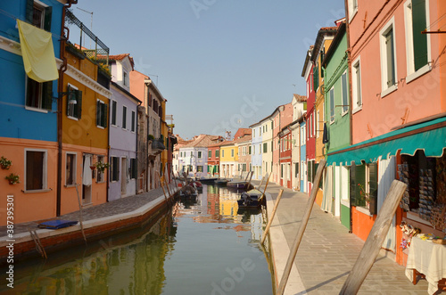 Burano is an island in the Venetian Lagoon, northern Italy, near Torcello at the northern end of the lagoon, known for its lace work and brightly coloured homes. © peacefoo