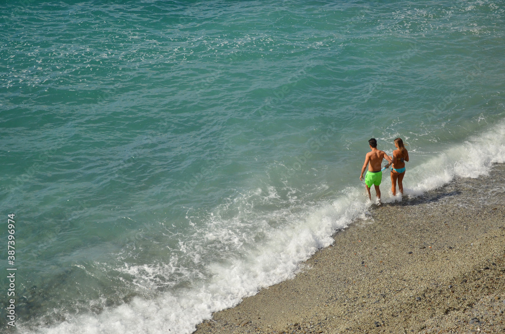 Beautiful beach at Monterosso, Cinque Terre, Italy. People enjoying their holiday here. Beautiful beach at Monterosso, Cinque Terre, Italy. People enjoying their holiday here.