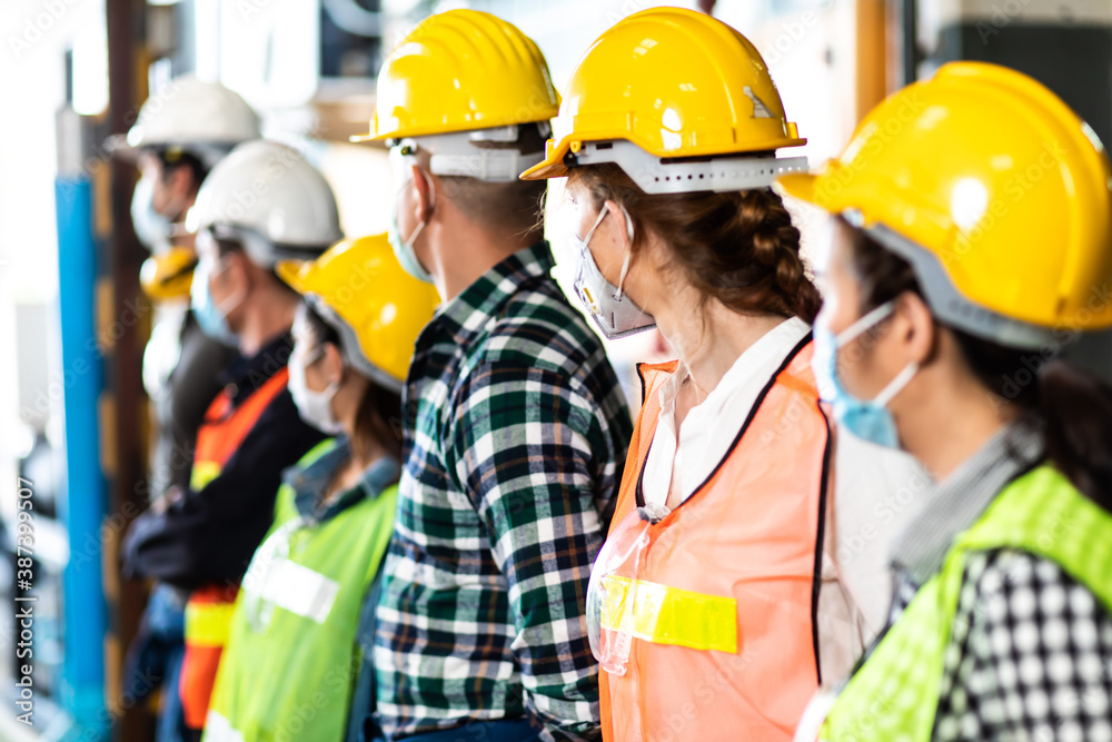 industry engineer team Asian wearing uniform and hard hats at Metal lathe industrial manufacturing factory. Engineer Operating lathe Machinery industry engineer team Asian wearing uniform and hard hats at Metal lathe industrial manufacturing factory. Engineer Operating lathe Machinery