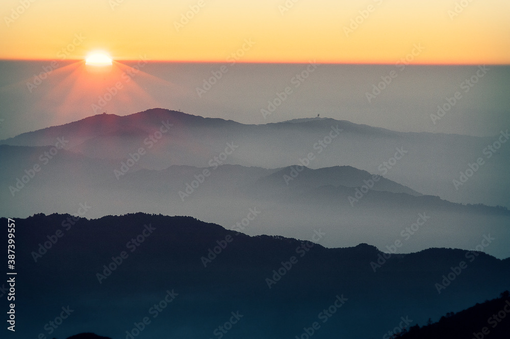 First sun rays in the morning in Sandakphu Trek, Himalayas. Singalia National Park, India