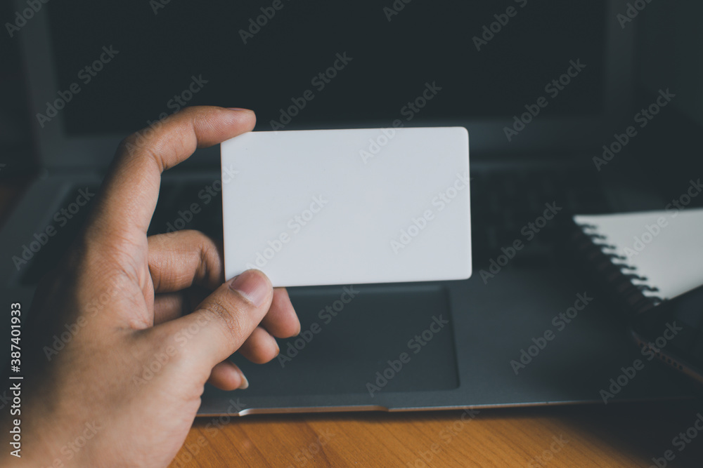 Business people hold credit cards and use computers Online shopping Office concept.. Business people hold credit cards and use computers Online shopping Office concept..