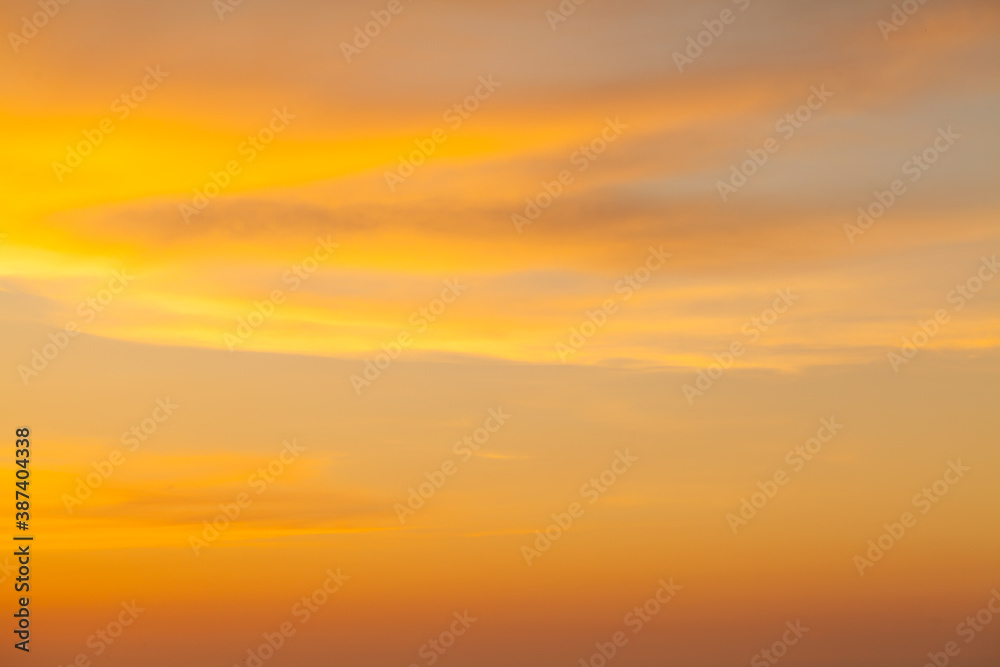 Bright sunset sky with clouds background