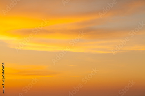 Bright sunset sky with clouds background © millaf