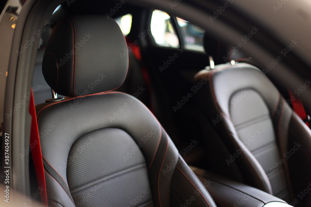 Close up and interior details of modern luxury sport cars. Comfortable leather cockpit seats inside luxury car. Close up and interior details of modern luxury sport cars. Comfortable leather cockpit seats inside luxury car.