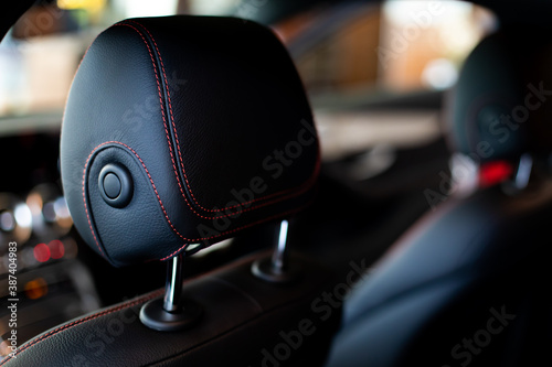 Close up and interior details of modern luxury sport cars. Comfortable leather cockpit seats inside luxury car. photo