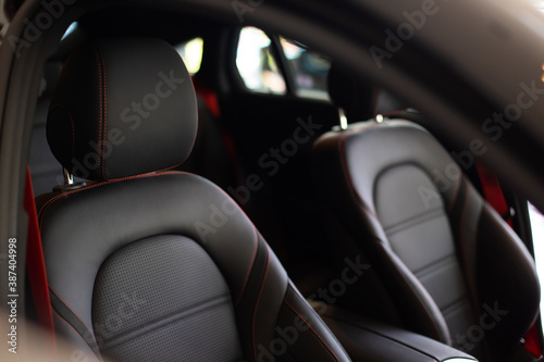 Close up and interior details of modern luxury sport cars. Comfortable leather cockpit seats inside luxury car. © NVB Stocker