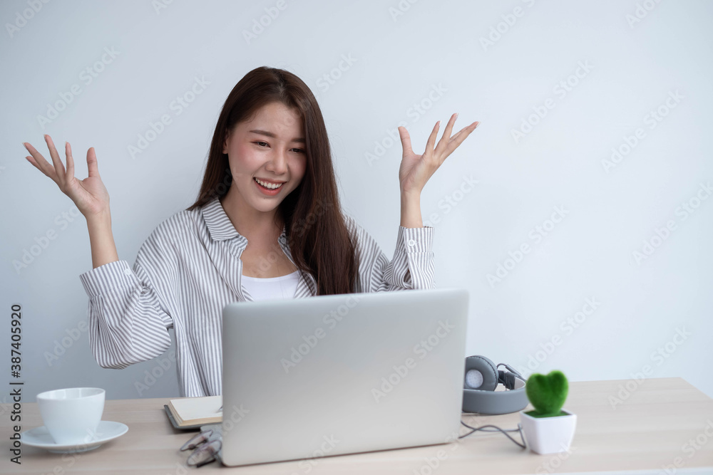 asian female use laptop computer and video call with friend in home, work from home concept. asian female use laptop computer and video call with friend in home, work from home concept.