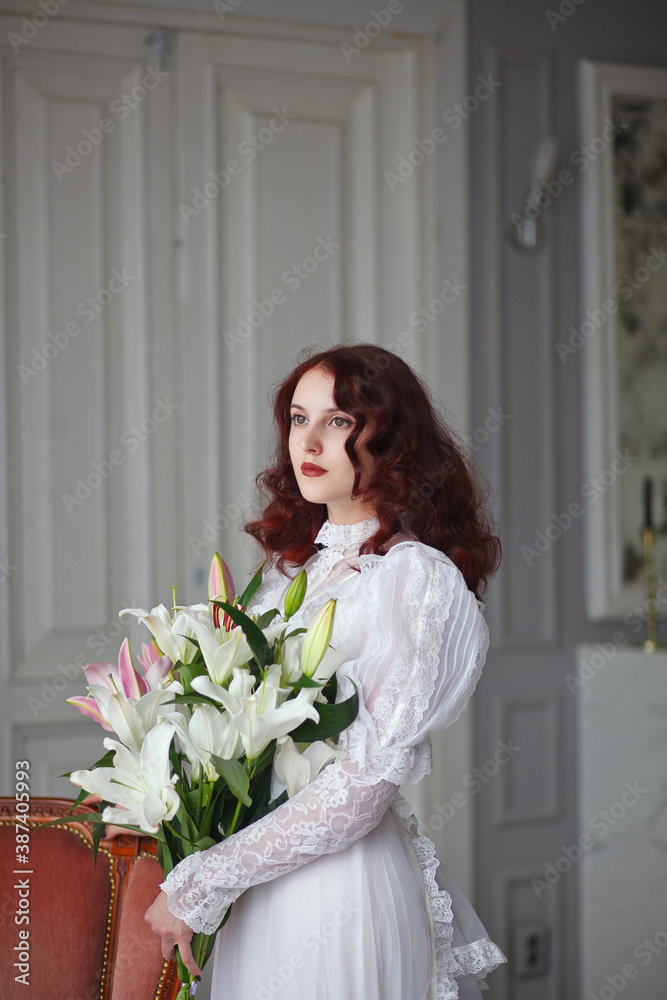 beautiful girl with a bouquet of lilies beautiful girl with a bouquet of lilies