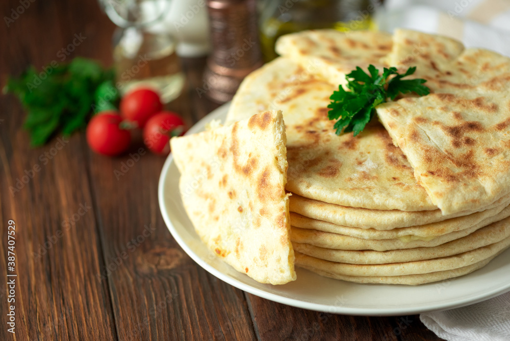 Khachapuri. Georgian traditional dish made from sulguni cheese and bread. Selective focus Khachapuri. Georgian traditional dish made from sulguni cheese and bread. Selective focus
