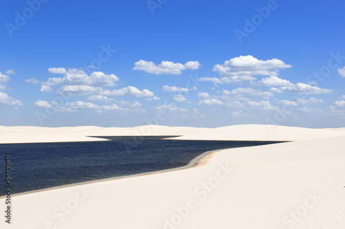 A blue lagoon in the middle of the sand dunes, in Lençóis Maranhenses National Park, Brazil.