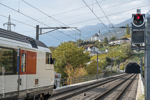 Eisenbahnstation Leuk mit Blick auf die Kirche von Susten, Kanton Wallis, Schweiz photo