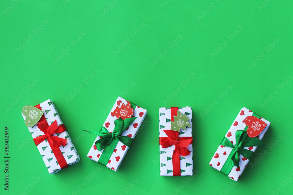 christmas gift boxes on a green background. Flat lay. Copy space. Congratulatory card, layout christmas gift boxes on a green background. Flat lay. Copy space. Congratulatory card, layout