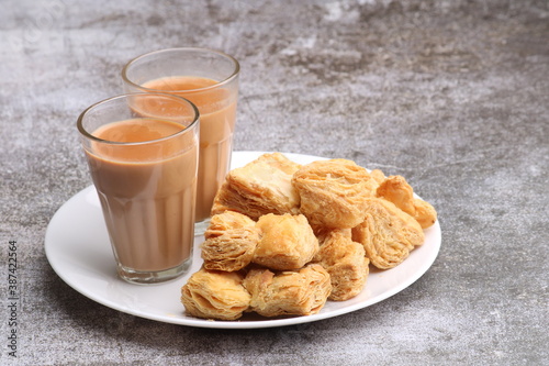 indian khari or kharee or salty Puff Pastry Snacks, served with indian hot tea.