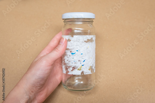 Removing sticky labels from glass jars. Hard to remove tags