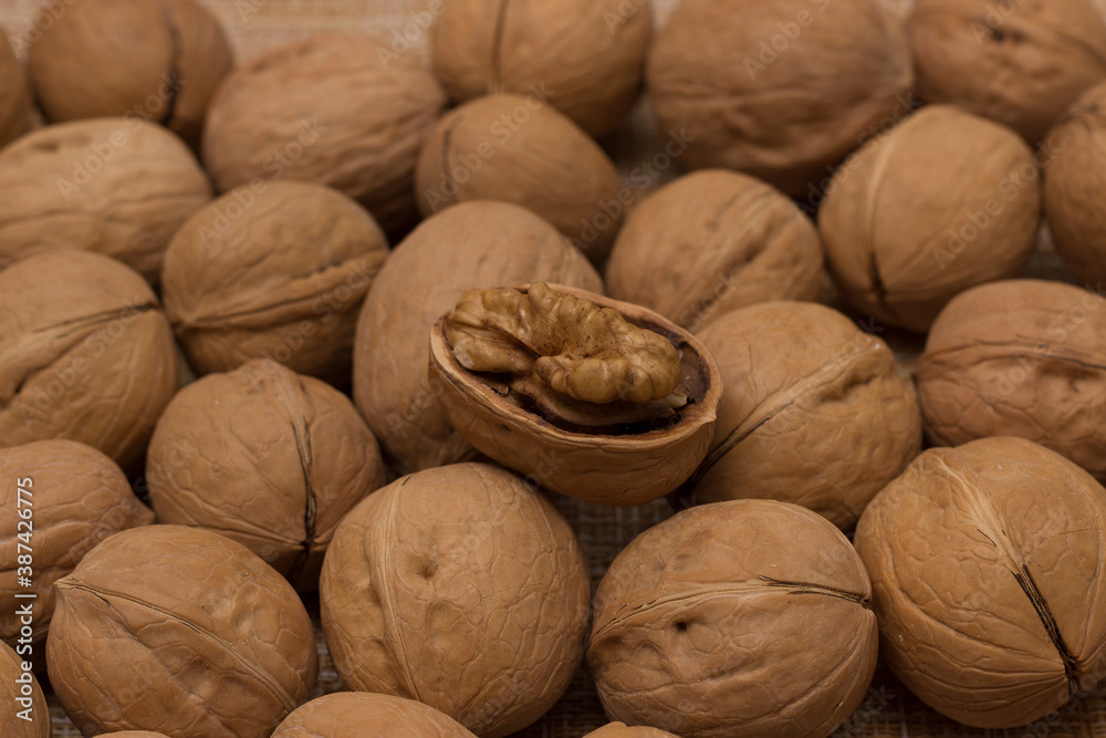 Walnuts in the shell close-up. Nut background. Copy space. Nuts, healthy food. Diet concept, vegan, vitamins