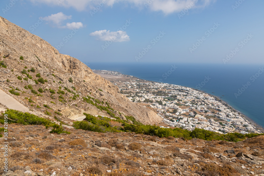View of the Kamari resoer, Mesa Vouno mountain, Santorini, Greece.