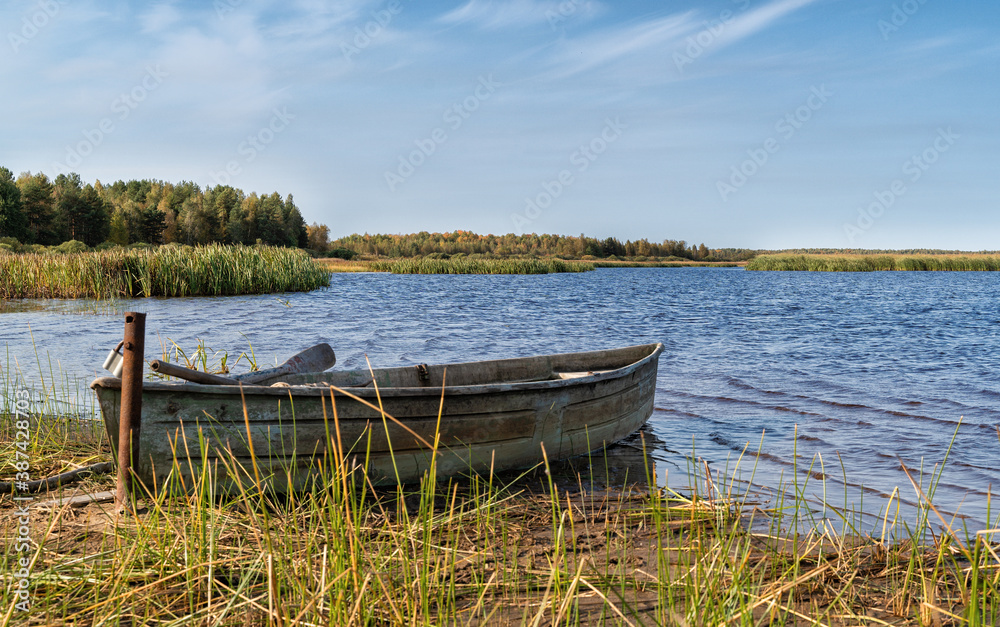 Svyatoe lake in the Meshchersky region in Russia with A broken boat on foreground.