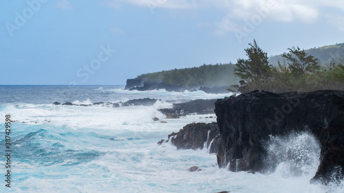 waves beating against the shoreline photo