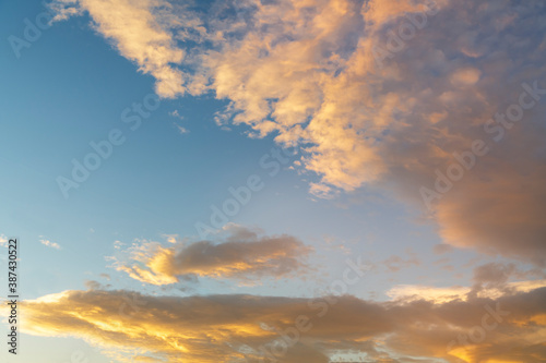 Beautiful colorful bright sunset sky with orange clouds. Nature sky background. © Inga Av