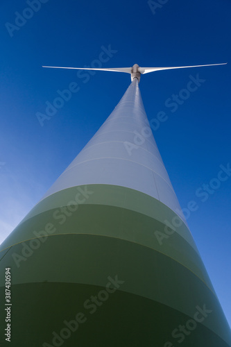 Huge wind turbine with blue sky