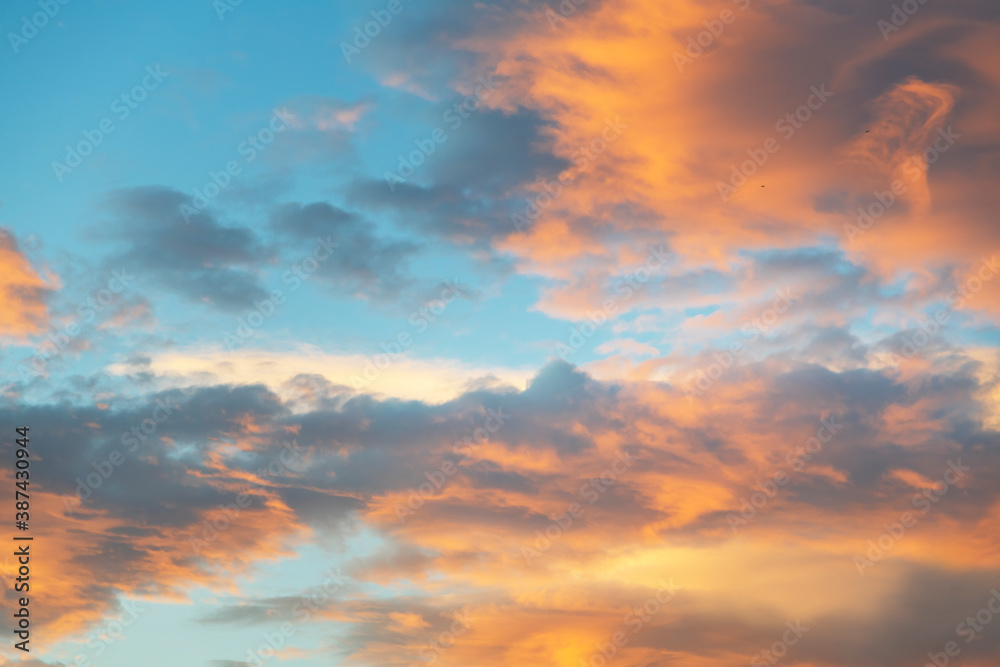 Beautiful colorful bright sunset sky with orange clouds. Nature sky background.


