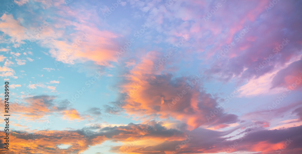 Beautiful colorful bright sunset sky with orange clouds. Nature sky background.


