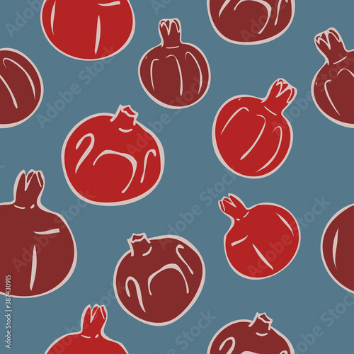 Vector seamless pattern with ripe pomegranates on a smalt blue background. Wallpaper or textile design. Concept for fruit store.