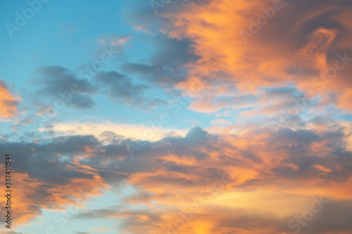 Beautiful colorful bright sunset sky with orange clouds. Nature sky background.   