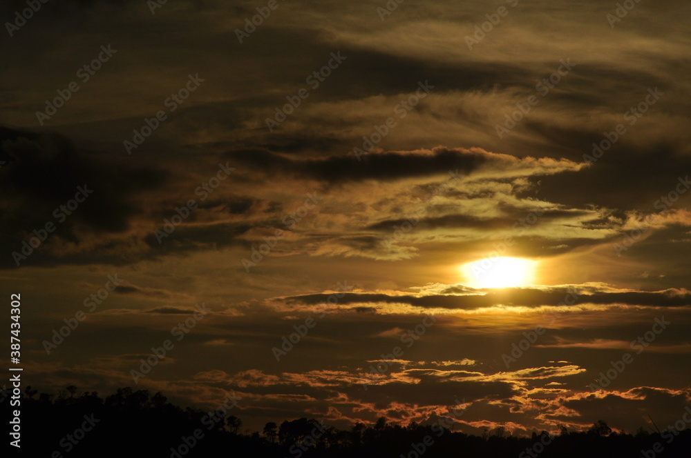 Sunset view with beautiful golden sky,the colorful sky lights in the evening