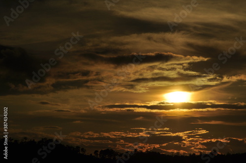 Sunset view with beautiful golden sky,the colorful sky lights in the evening