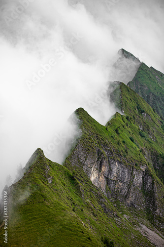 mountain peak in the clouds. top of mountains. Swiss alps