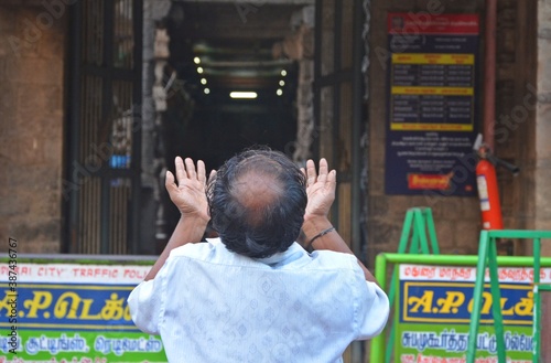 Photography Devotee in front of temple