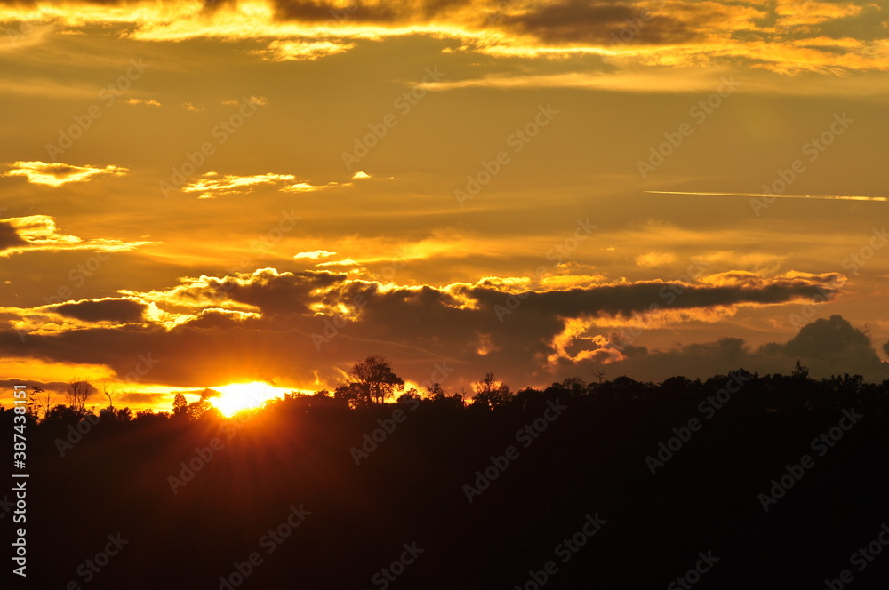 Sunset view with beautiful golden sky,the colorful sky lights in the evening