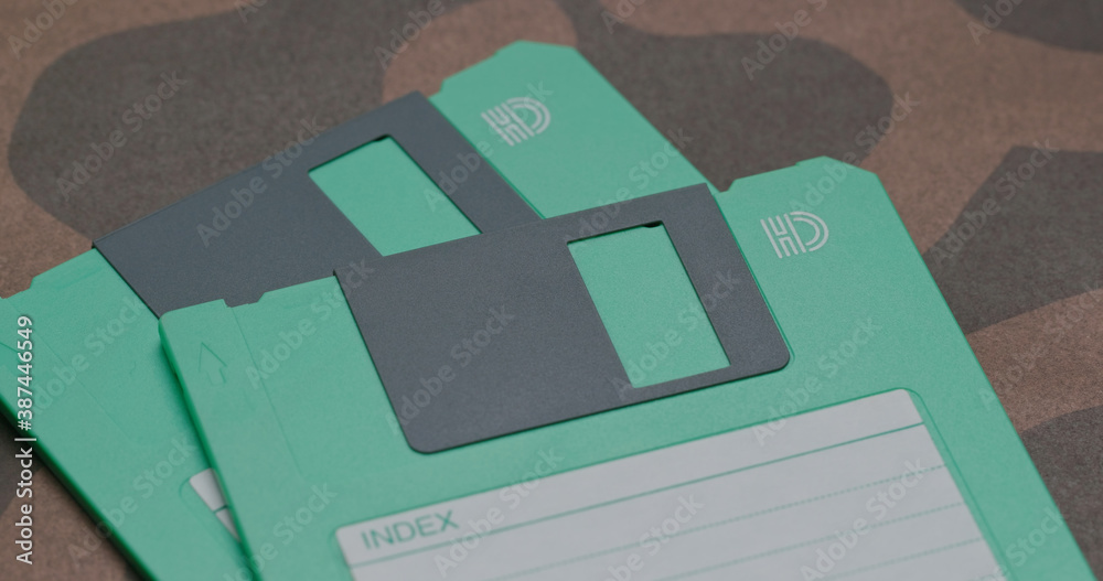 Two Green floppy disc on table Two Green floppy disc on table