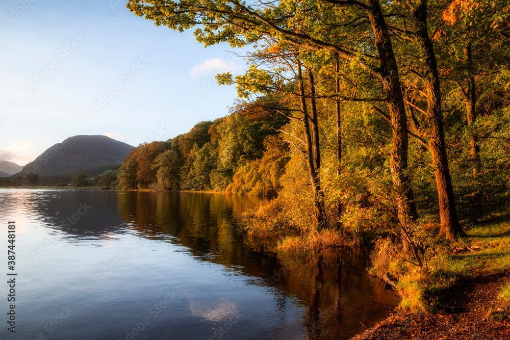 Stunning epic sunrise landscape image looking along Loweswater towards wonderful light on Grasmoor and Mellbreak mountains in Lkae District