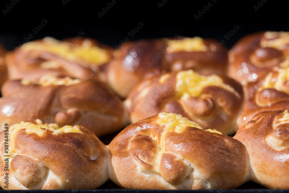 Traditional Romanian sweets knows as poale in brau, freshly homemade cheese and dill buns on display for sale at a street food market, top view of healthy food photographed with selective focus.