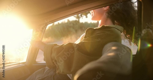Wallpaper Mural Young woman leaning out of the car window at sunset Torontodigital.ca